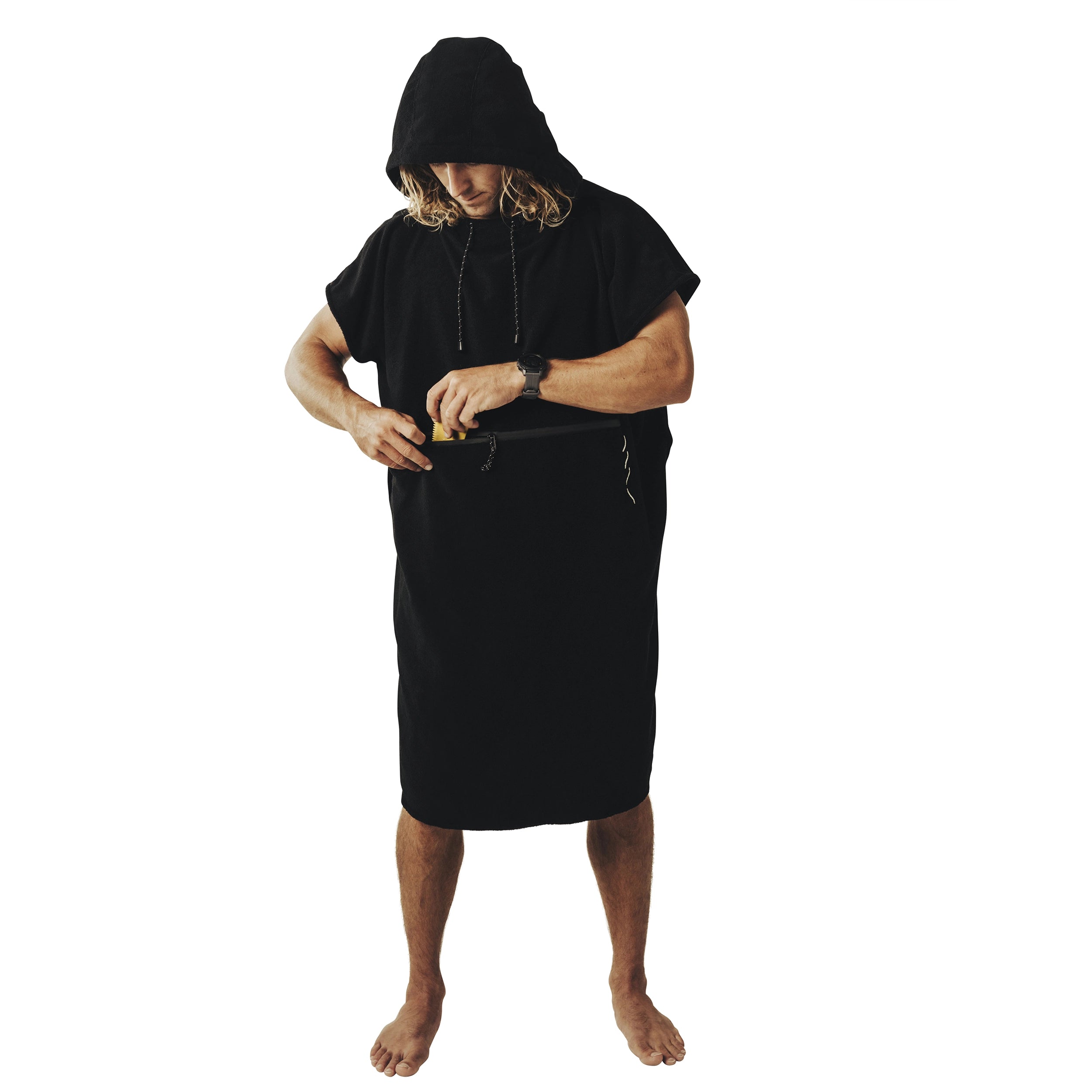Man wearing the black SAAL Surf Changing Poncho with the hood up, front view