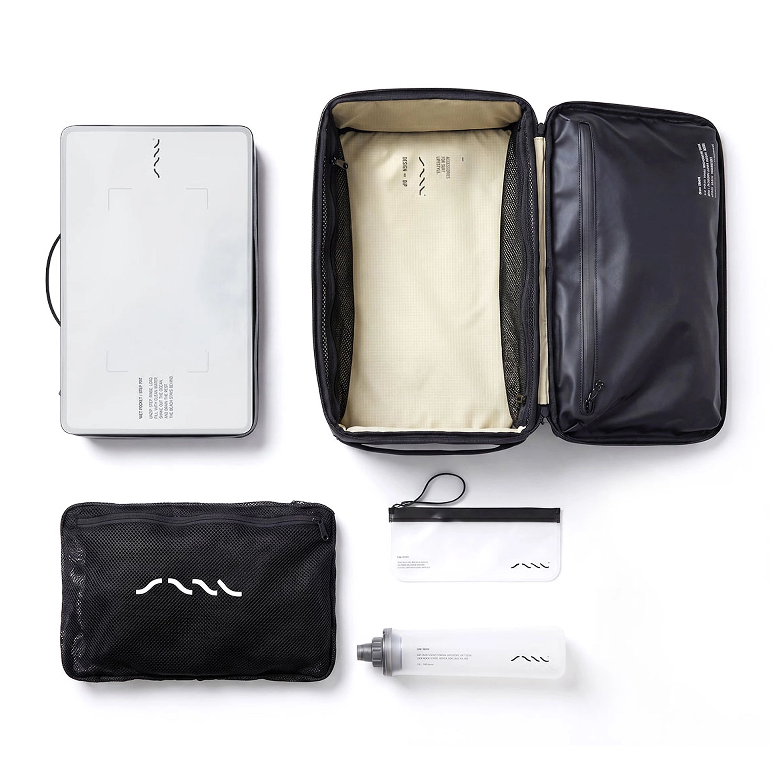 SAAL Full Bag Kit laid out: open Surfpack, step mat, poncho, Surf Rinse shower and Surf Stash pouch