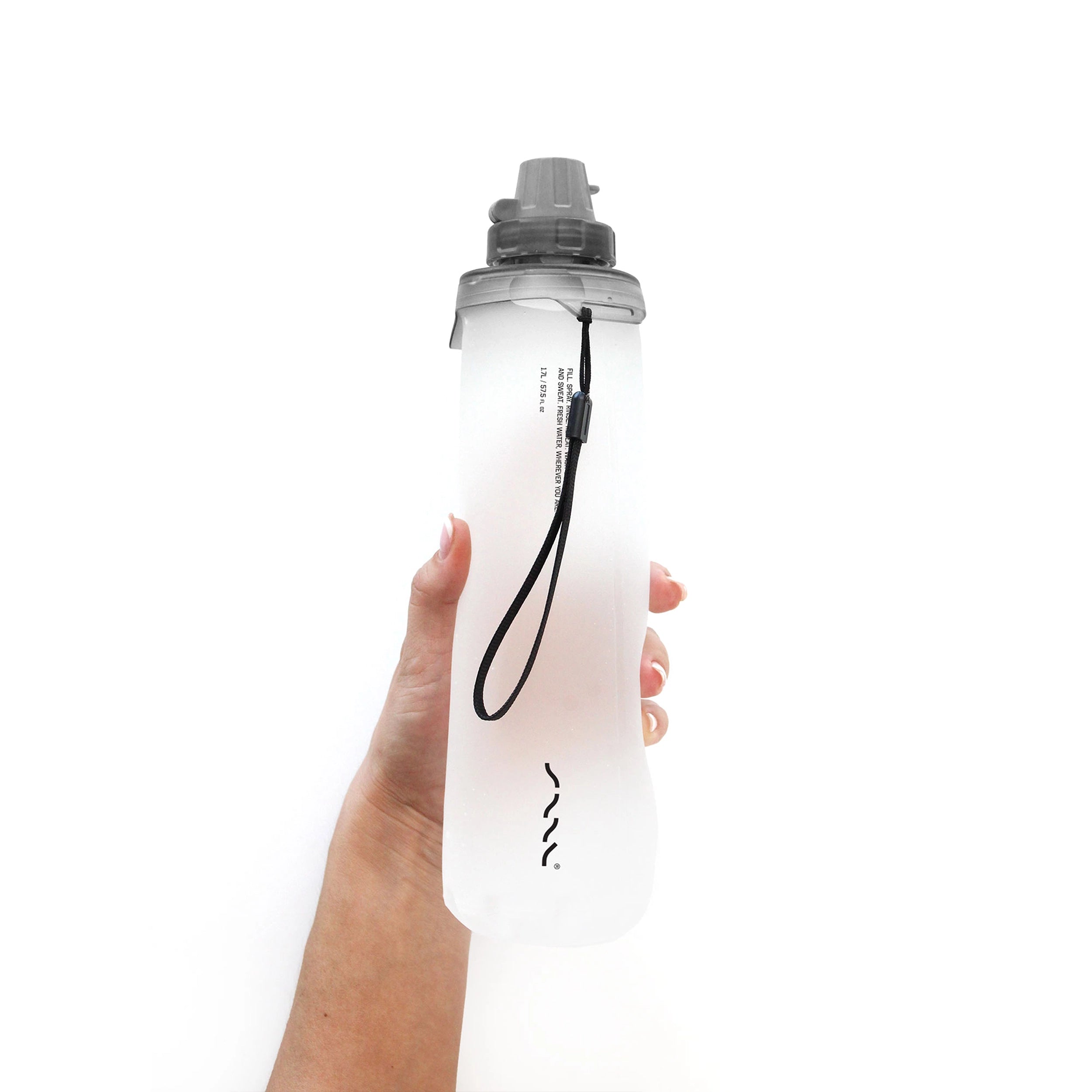 SAAL Surf Rinse 1.2L translucent squeezable portable shower held in hand