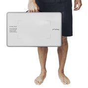 Man carrying the SAAL Wet Pocket step mat by its handle